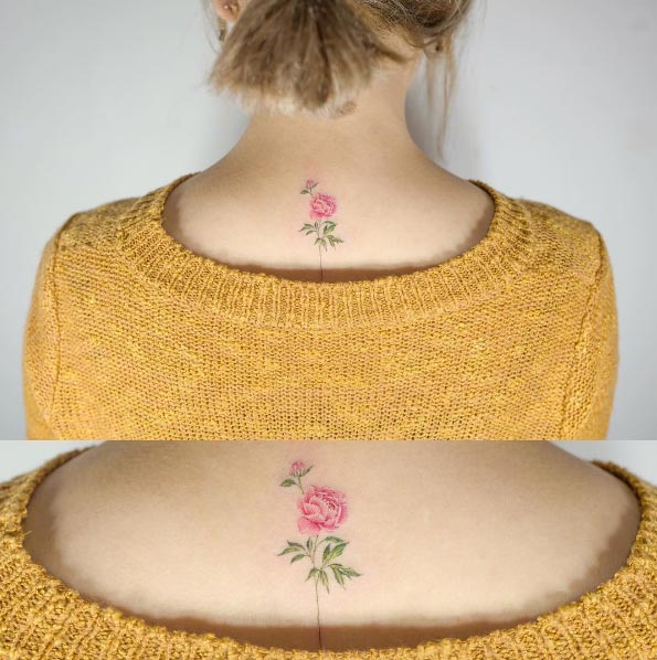 Tiny pink rose tattoo by Sol Art