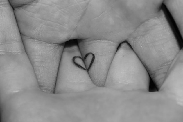 heart-forming-wedding-ring-tattoo