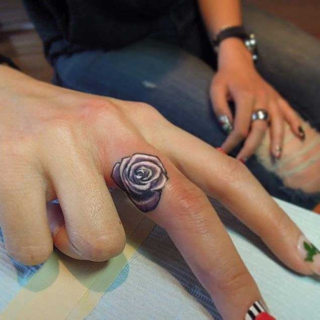Rose tattoo on finger