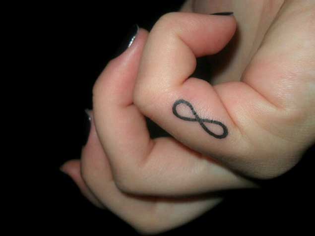 Infinity finger tattoo