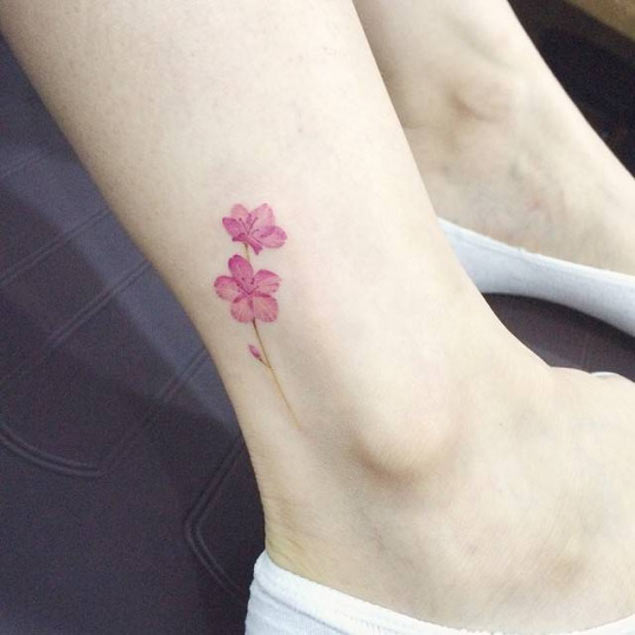 Tiny Pink Flower Tattoo