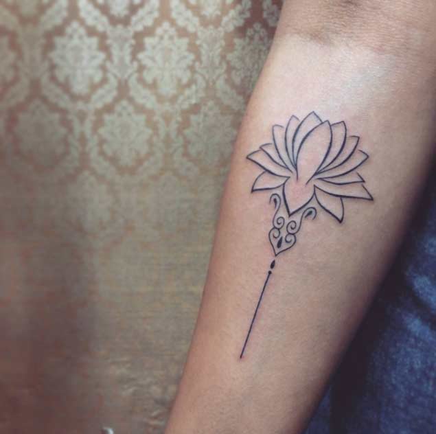 Minimalistic lotus flower tattoo