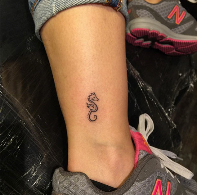 Tiny seahorse tattoo on ankle