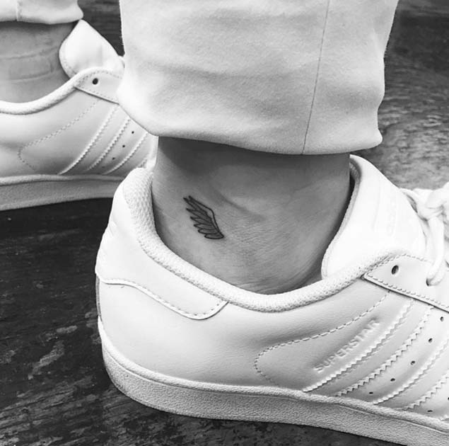 Small wing tattoo on ankle