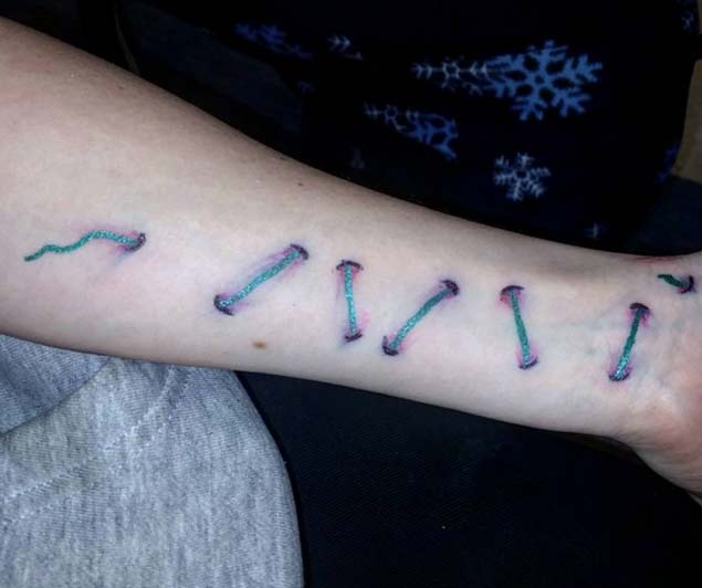 optical illusion stitches tattoo