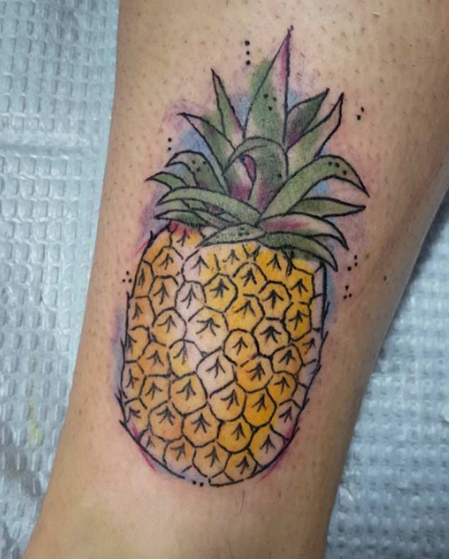 This wonderful watercolor pineapple tattoo
