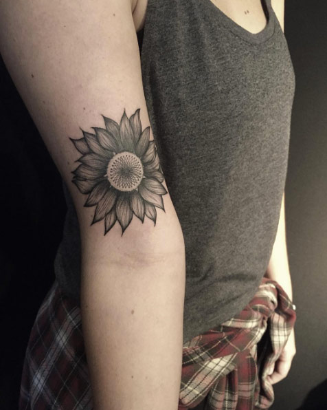 Sunflower tattoo with outlined petals by Lianna Sabrina 