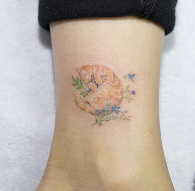 Tiny Cat Tattoo on Ankle by Sol Art