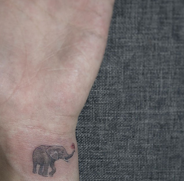 Cute Elephant Tattoo on Wrist by Sol Art