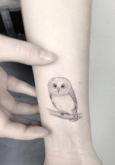 Delicate Owl Tattoo on Wrist by Jakub Nowicz