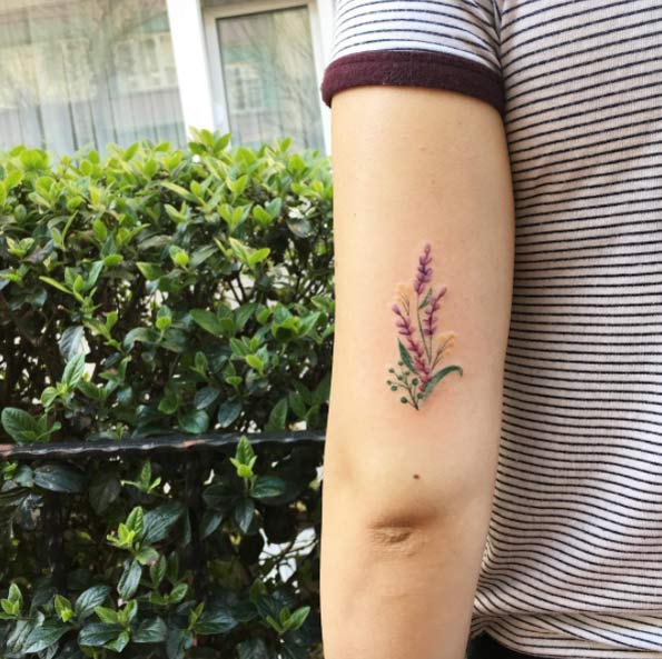 Elegant Floral Tattoo on Tricep by Fatih Odabas