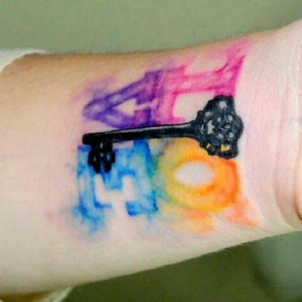 Watercolor LOVE Tattoo on Wrist by Koray Karagozler