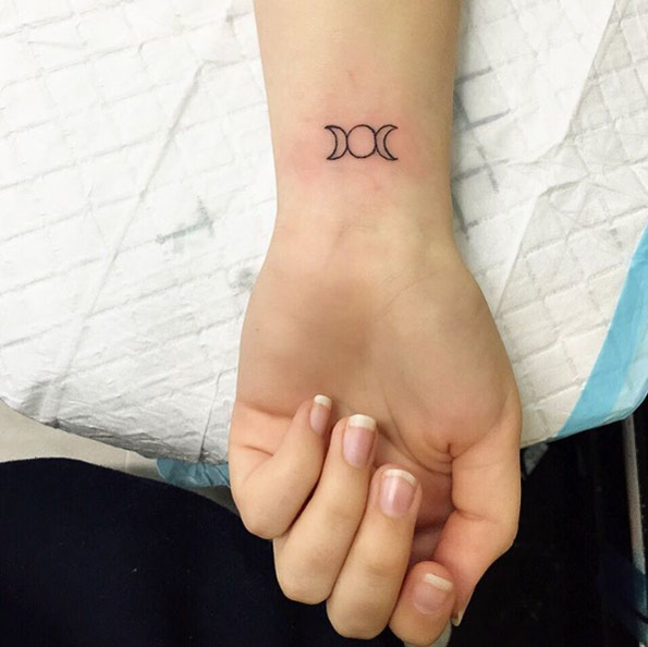 Tiny Triple Goddess Tattoo on Wrist by Lauren WInzer