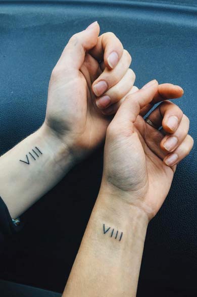 Roman Numeral Couple Tattoos by Natasha Hum