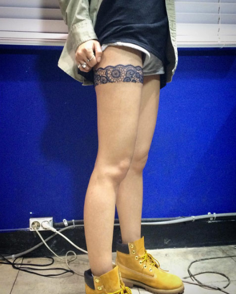 Gorgeous garter tattoo by Wonjun Jang
