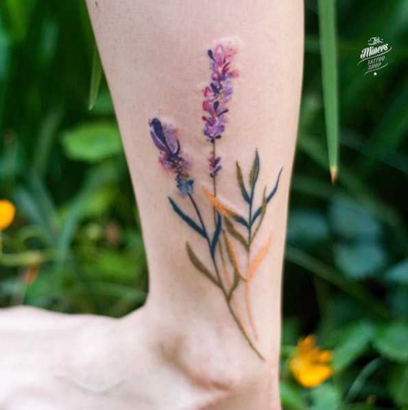 Hyper-realistic flowers on ankle by Magdalena