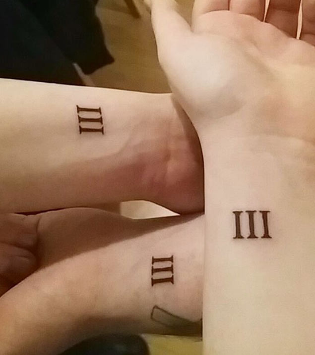 Roman Numeral Sibling Tattoos on Wrist