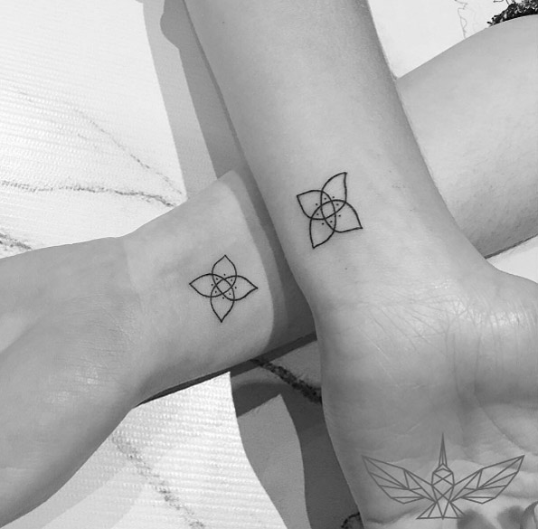 Sisterhood flower tattoos by Cholo