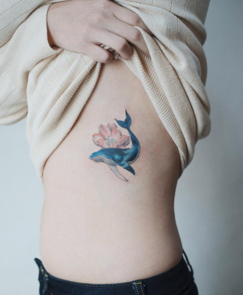 Feminine Whale Tattoo on Ribcage by Sol Art