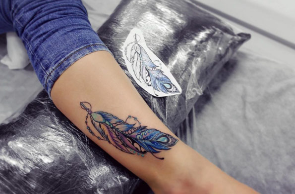 Cute Indian Feather Tattoo by Anna Yershova