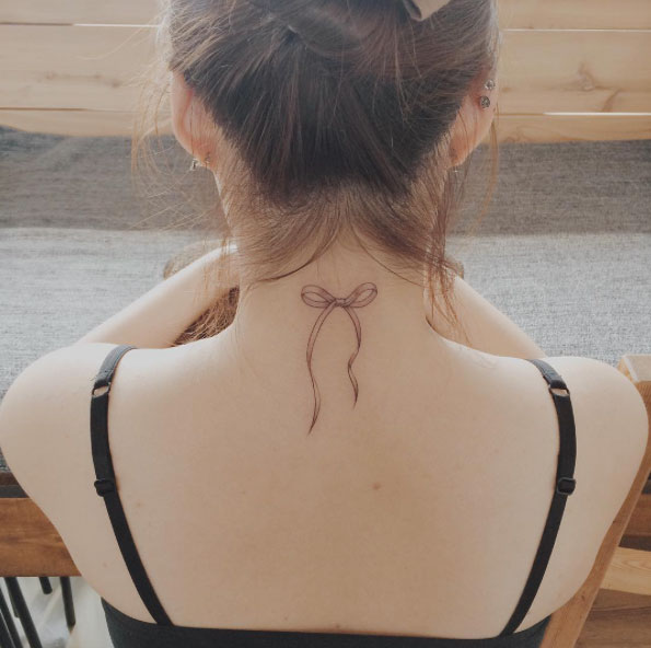 Cute Ribbon Tattoo on Neck by Doy