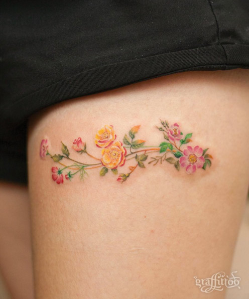 Cute Floral Thigh Tattoo by Graffittoo