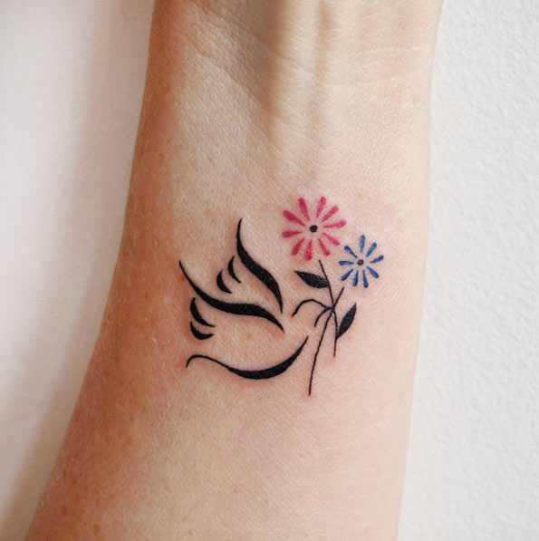 Small Dove Tattoo on Wrist by Jessica Channer 