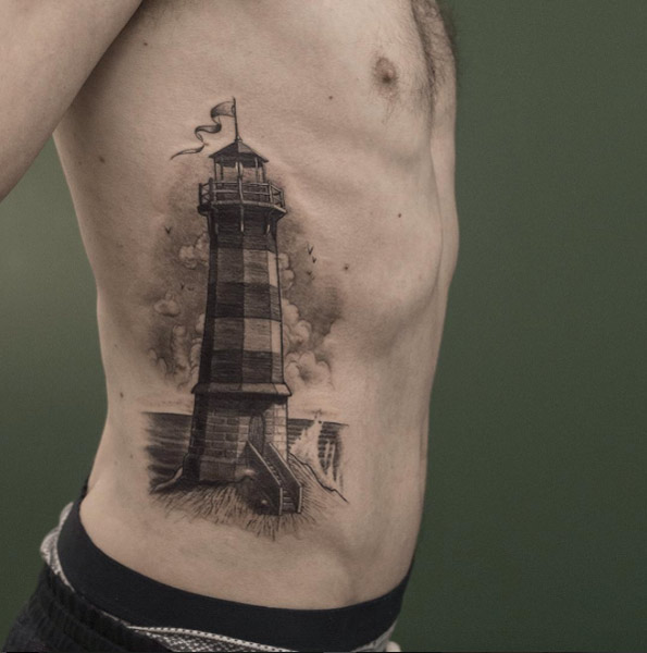 Black and Grey Ink Lighthouse Tattoo by Sven Rayen