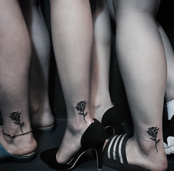 Matching Rose Tattoos on Ankle by Blackman Tattoo