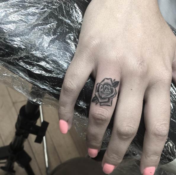 Tiny Rose Finger Tattoo by Califas