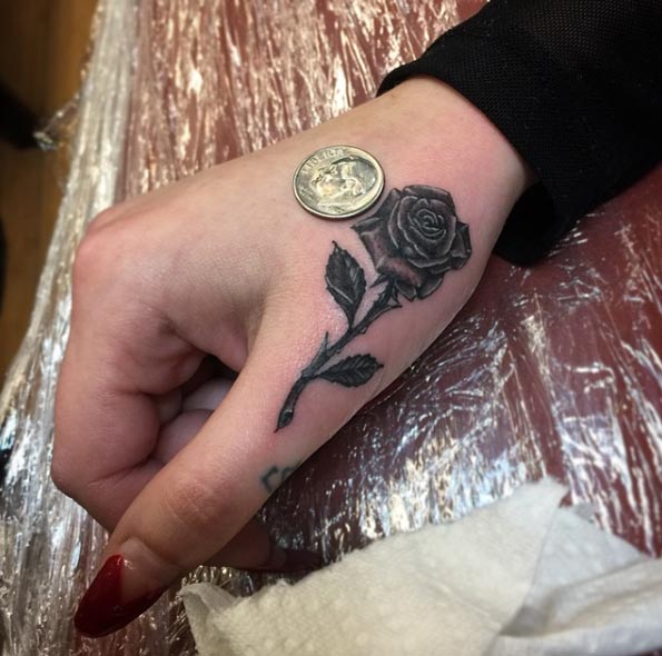 Rose Tattoo on Finger by The Black Rooster