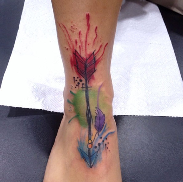 Watercolor Arrow Tattoo on Foot by Daniel Baker
