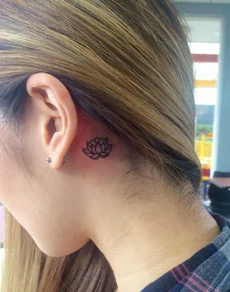 Minimalistic Lotus Flower Tattoo Behind Ear by Jen