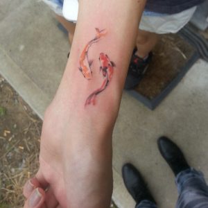 Watercolor koi fish on wrist by Jemka
