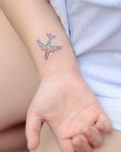 Tiny Watercolor Airplane by Hello Tattoo