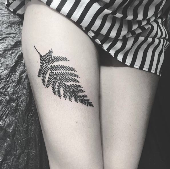 Blackwork fern on thigh by Ellemental Tattoos