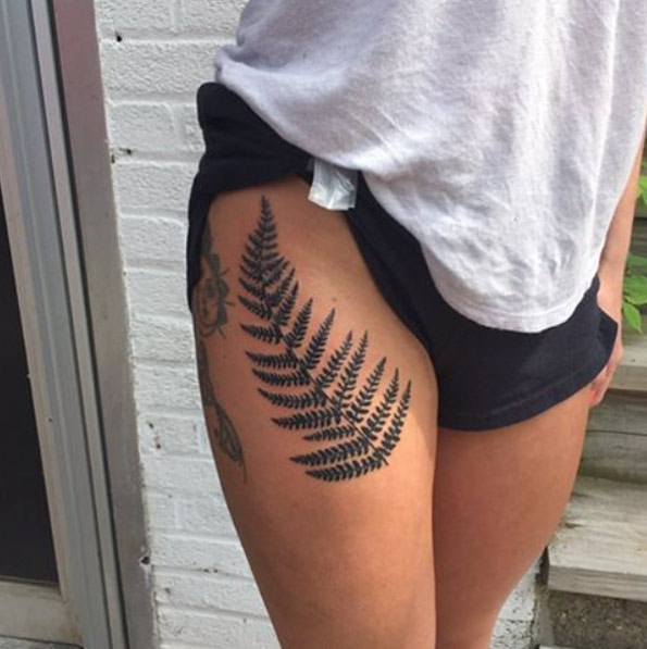 Large fern on thigh by Johnny