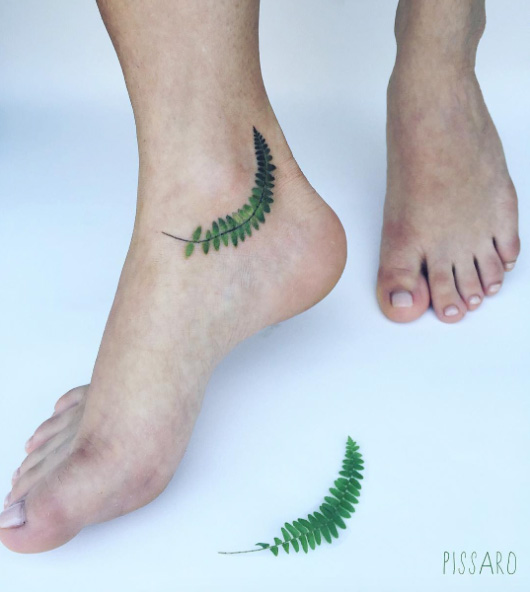 Fern tattoo on ankle by Pis Saro