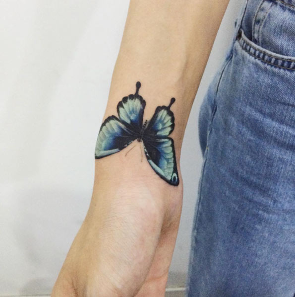 Brilliant black and blue butterfly by Doy
