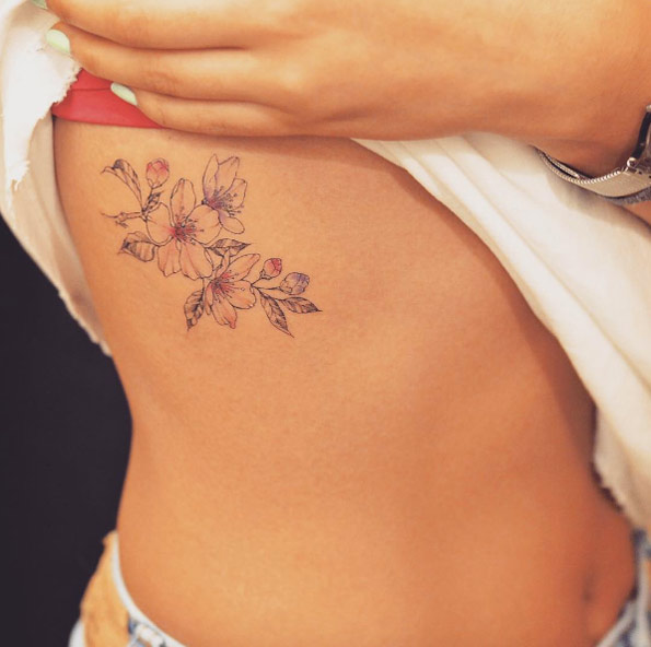 Cherry blossoms on ribcage by Grain