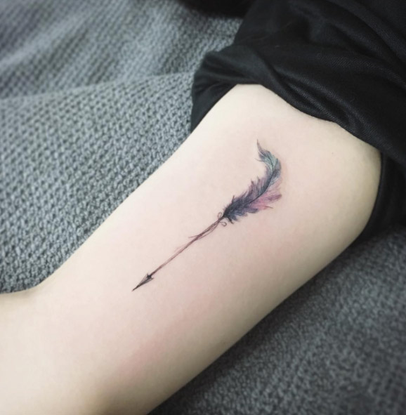 Small arrow on arm by Tattooist Flower