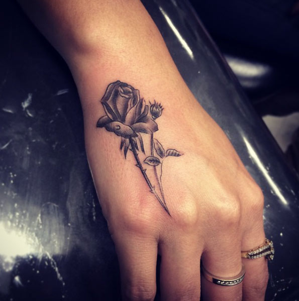 Rose on hand by Isaiah Negrete