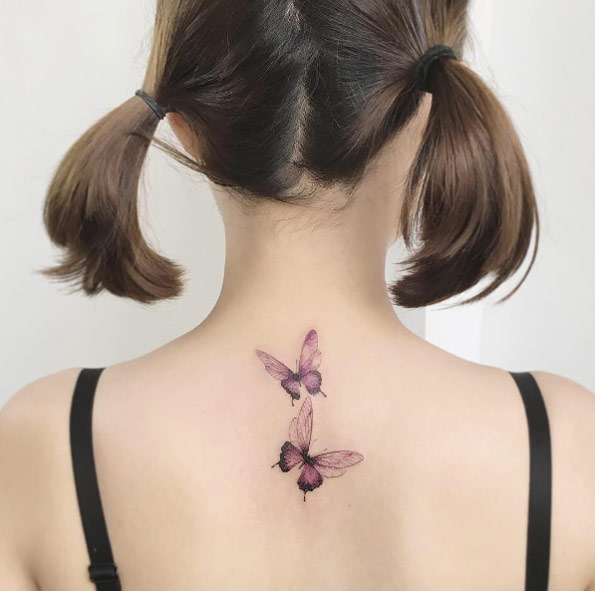Butterflies on back by Flower