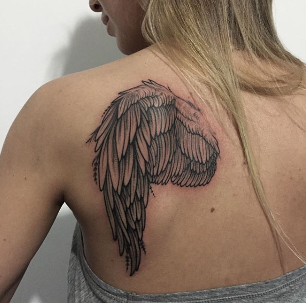 Single Wing Tattoo on Back by Sasha Masiuk