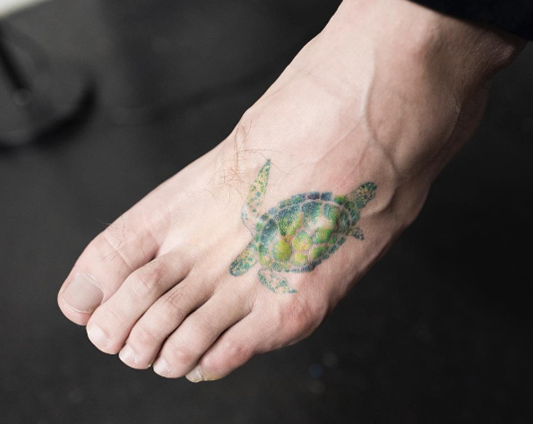 Sea turtle tattoo on foot by Hongdam