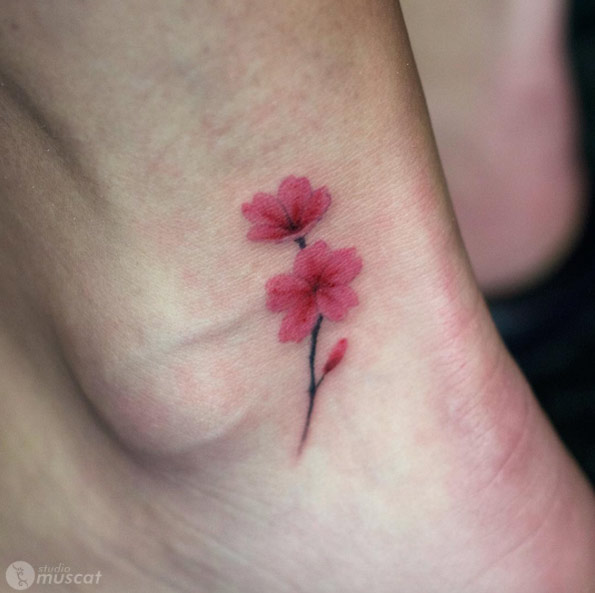 Tiny pink blossoms on ankle by Muscat