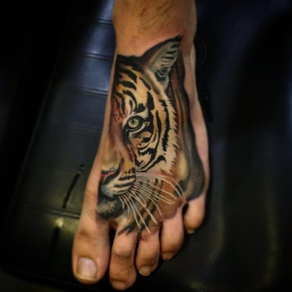Tiger on foot by Kyle Brus