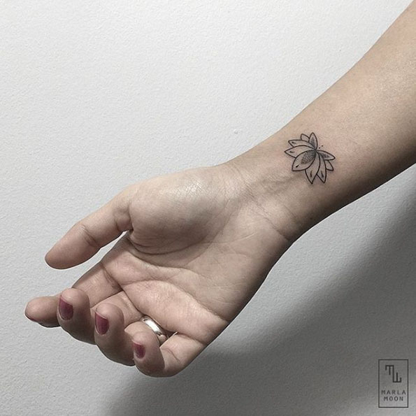 Lotus flower on wrist by Marla Moon