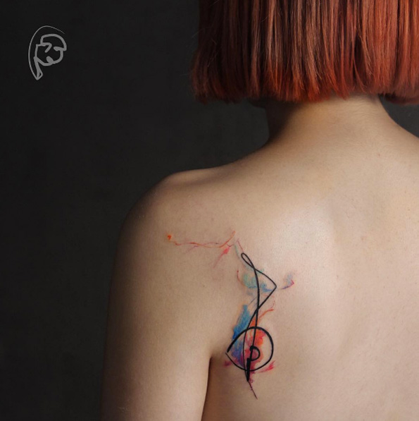 Abstract watercolor tattoo on back shoulder by Tayfun Bezgin