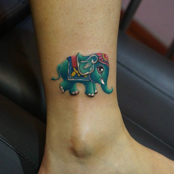 Turquoise Indian elephant tattoo by Wang Lei